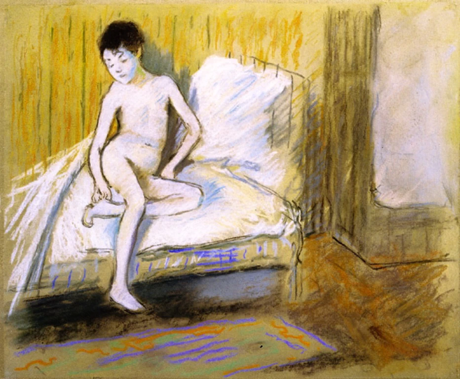 Giovane nuda su un letto